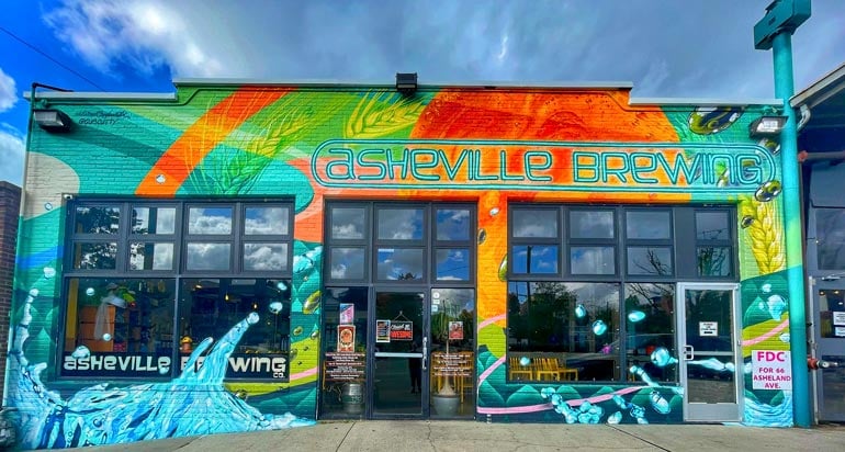 asheville brewing co. exterior with colorful mural