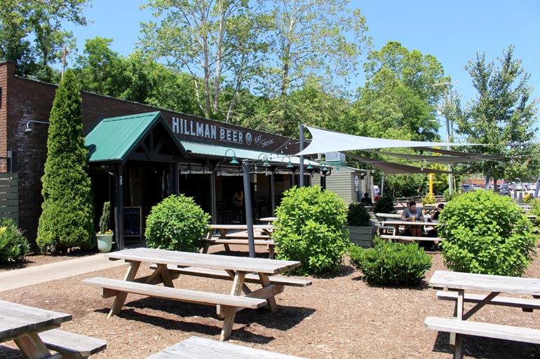 hillman beer asheville outdoor patio area in bright sunlight