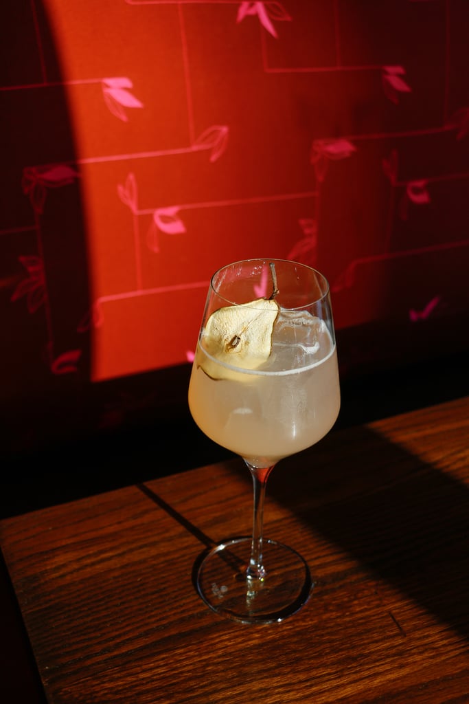 Christmas cocktail pear sangria made with rosé, elderflower, and fresh pear slices. Pear Sangria from Ambler Denver.