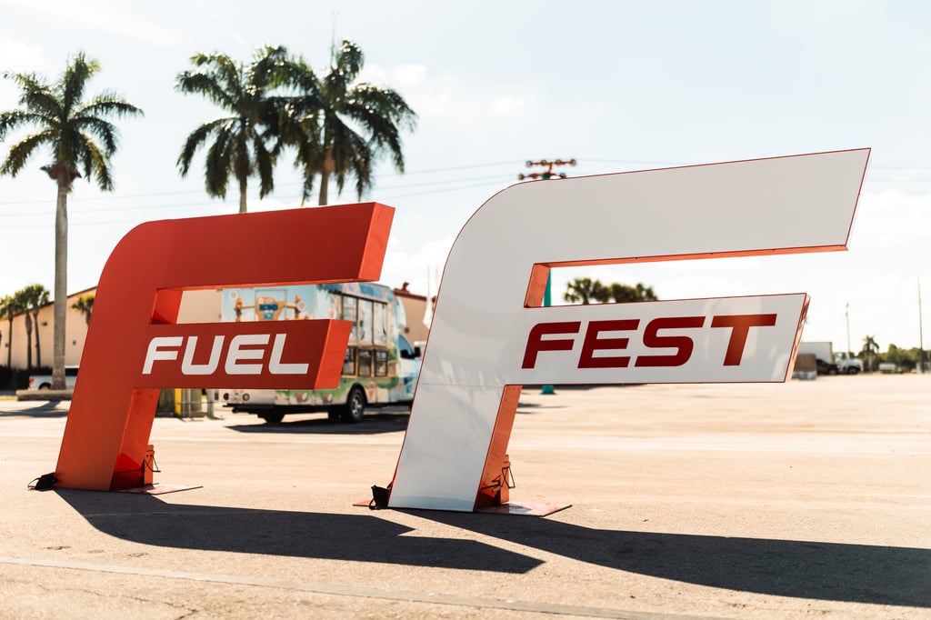 fuel fest logo with palm trees behind
