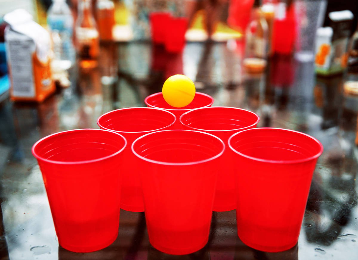 beer pong being played with a light lager
