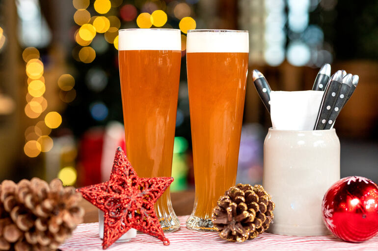 Festive beer glasses with holiday decorations, celebrating beer and holiday competitions