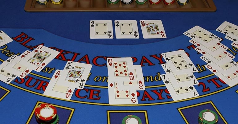 Enjoying a beer over a game of blackjack