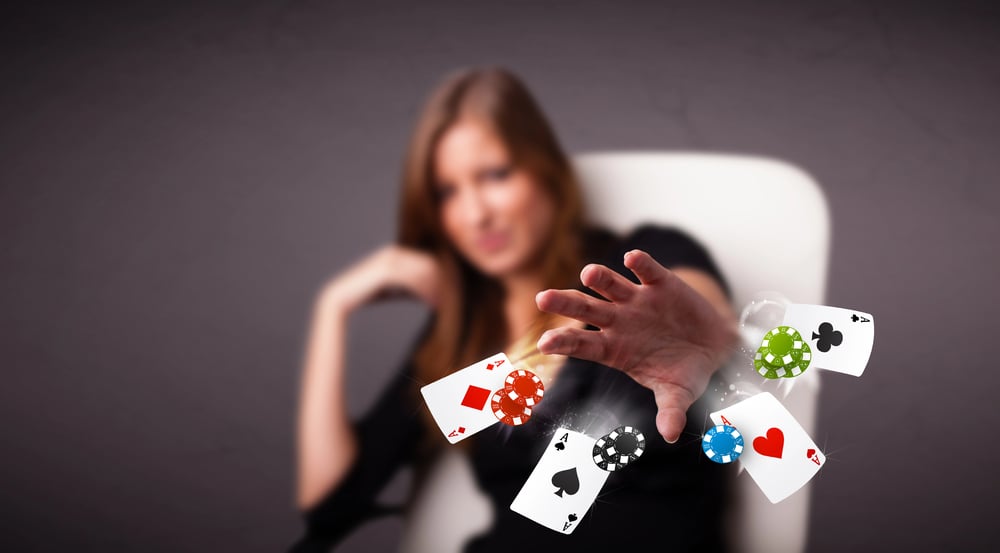 Woman playing at a casino with controlled emotion