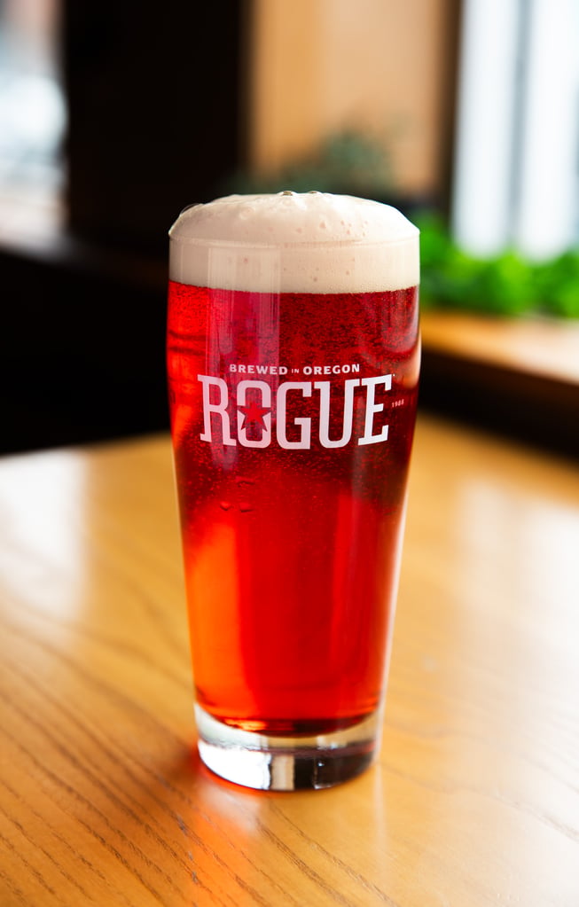 rogue cherry wheat ale glass on wood table