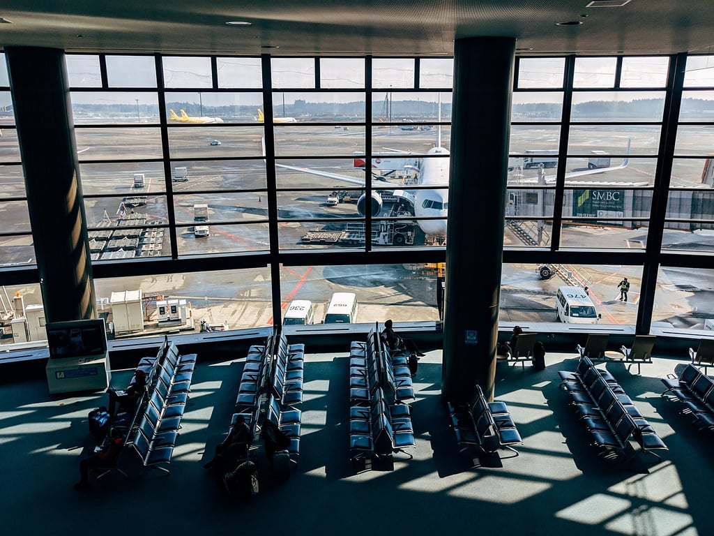 airport lounge with plane outside window