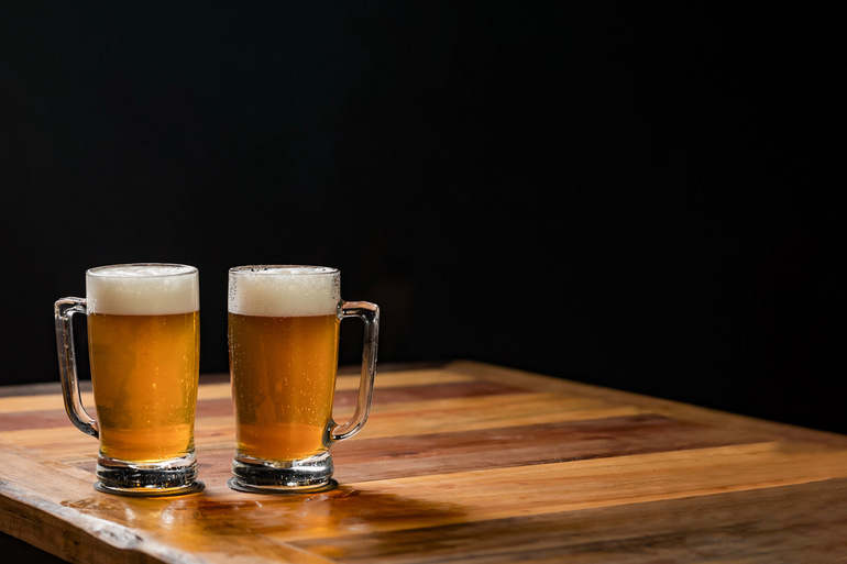 Two best beer mugs filled with beers from the Southern Hemisphere