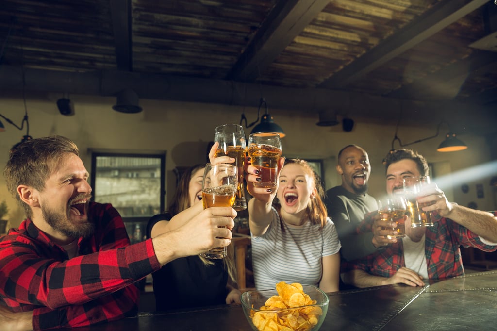 people enjoying beer at a bar