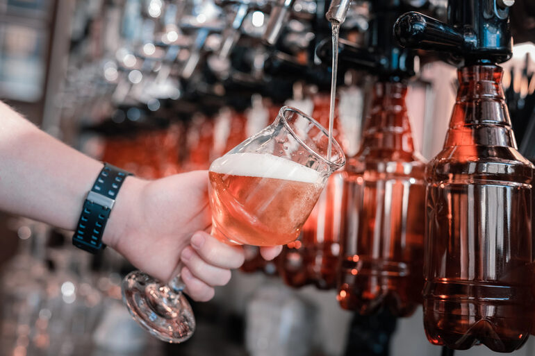 A sports fan pouring fresh beer at a local brewery in Arizona