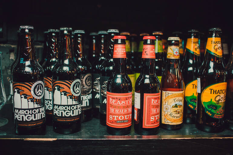 Bottles of best beers featuring stouts and ciders from small-town breweries