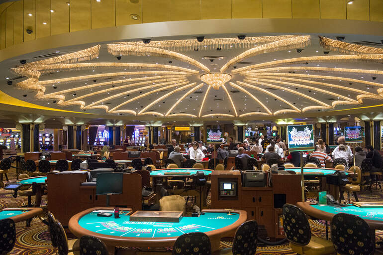 Tourists from different countries gambling in a casino in the US
