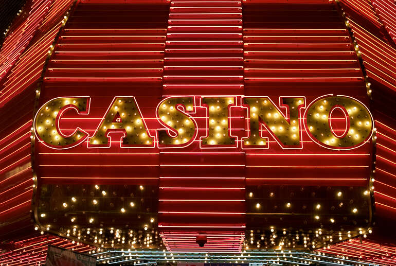 A brightly lit real money casino sign