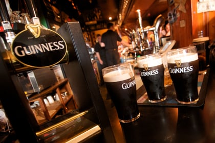 Guinness pints atop a bar