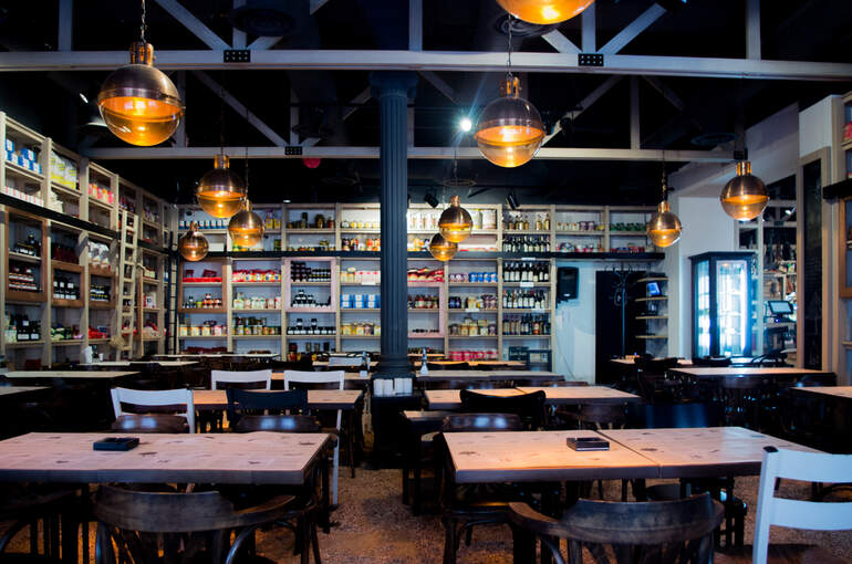 Interior of a brewery taproom with lounge-style seating and ambient lighting