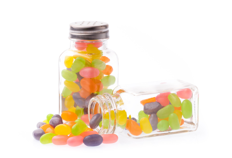 Glass jars filled with colorful THCV gummies
