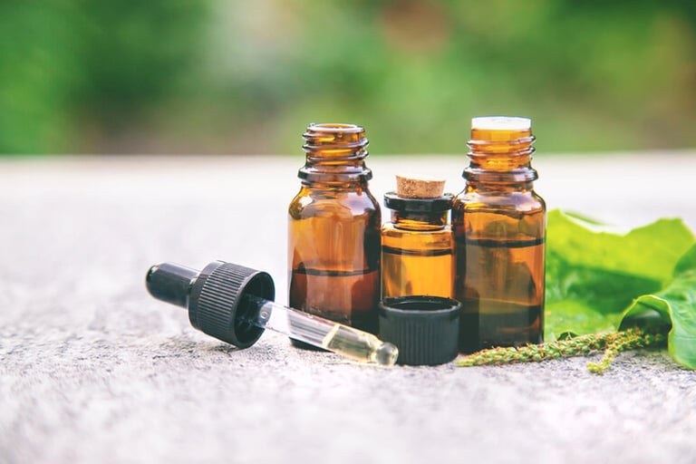 CBD tincture bottles with dropper on natural surface for sleep support