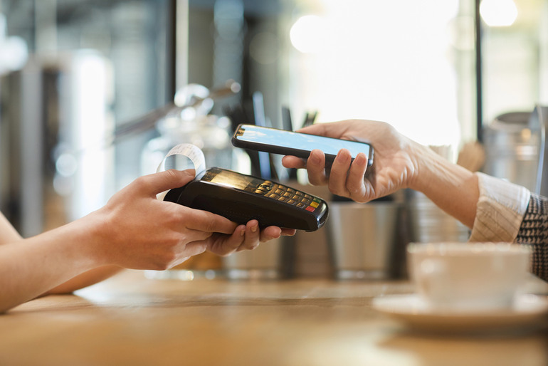 A customer is making an NFC transaction