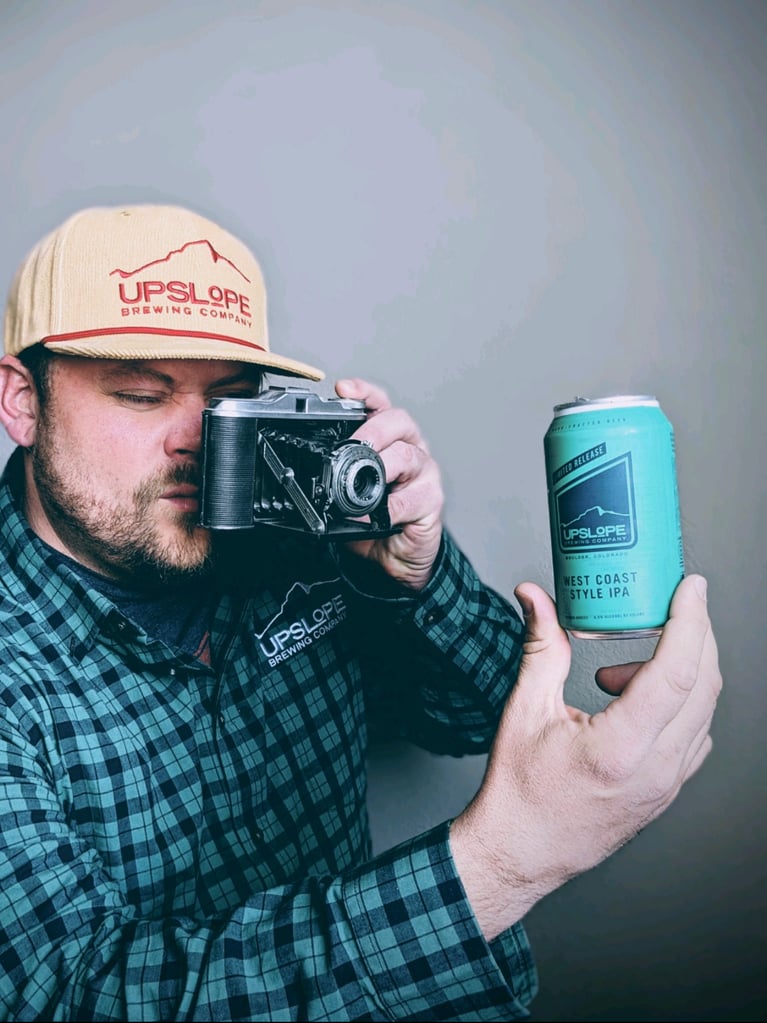 A Beer Distribution Rep Photographing a Beer Can