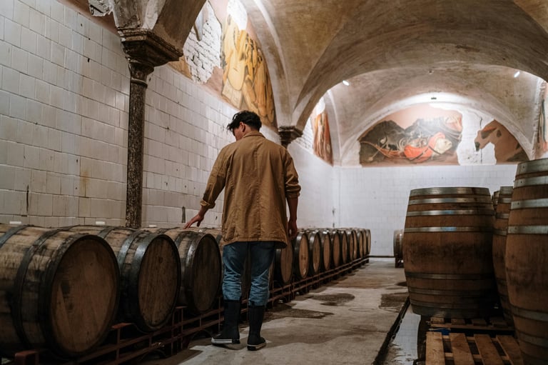man touching barrels checking for PFAs