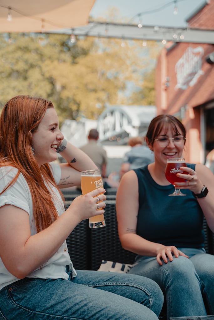 two people enjoying a pint at Liability Brewing Co.