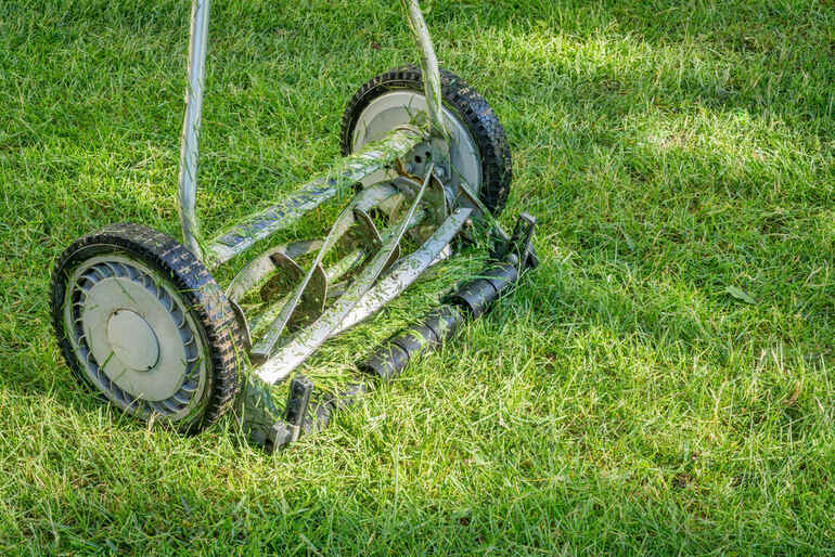 Close-up of a lawn mower belt that transfers engine power to the blades and moving parts