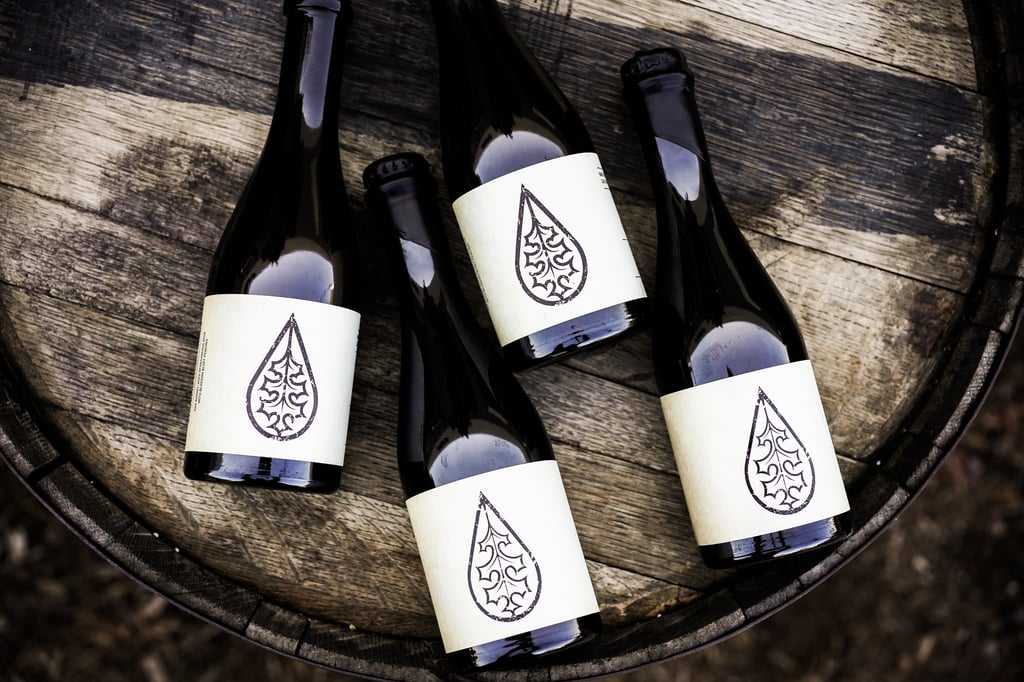 Pure Project Barrel-Aged Beers Placed on a Barrel