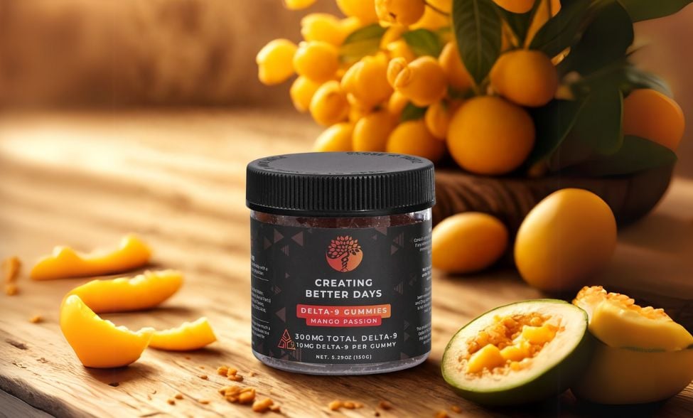 Delta-9 gummies in mango passion flavor displayed beside fresh mango and passion fruit