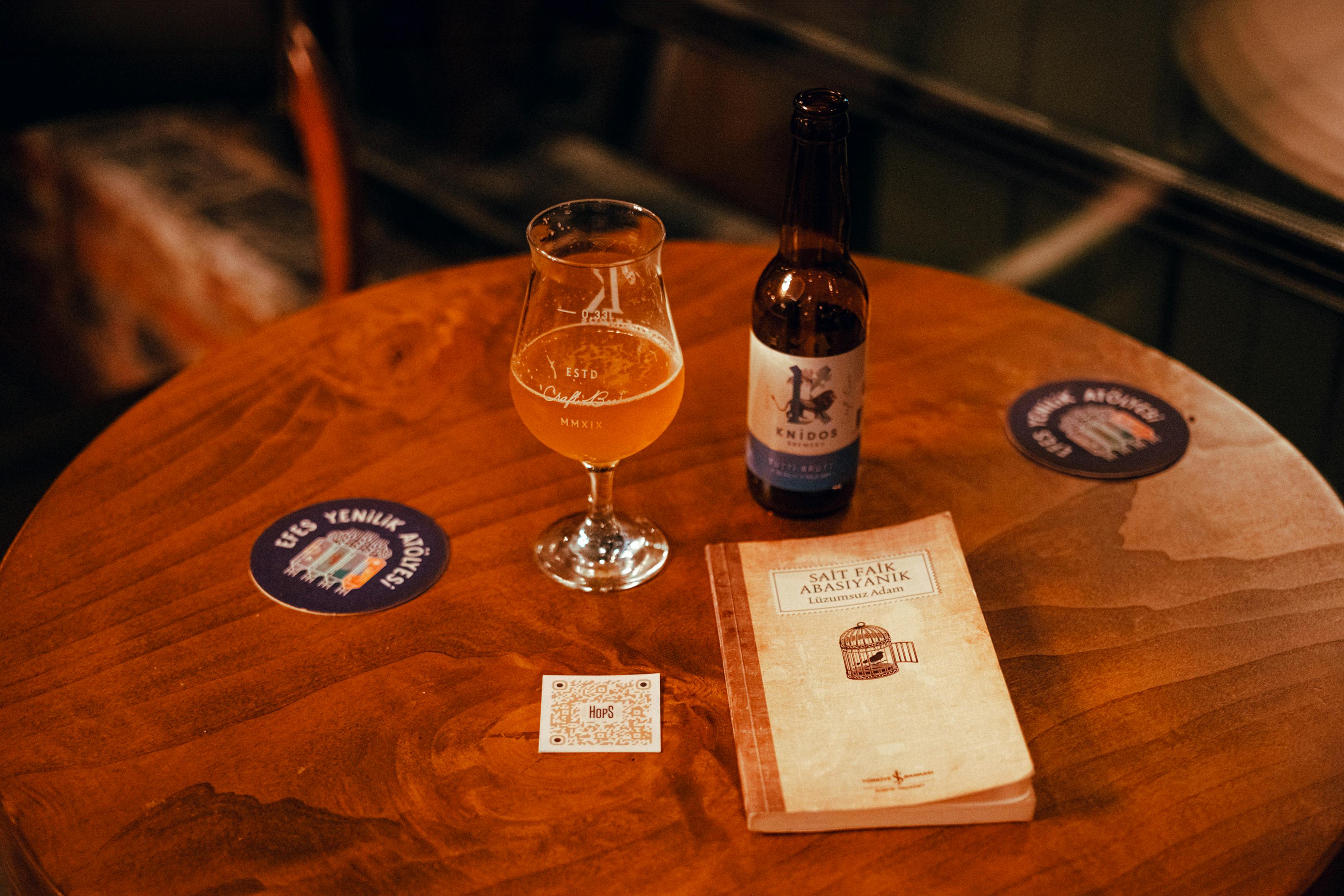 Beer and a Book on a Table