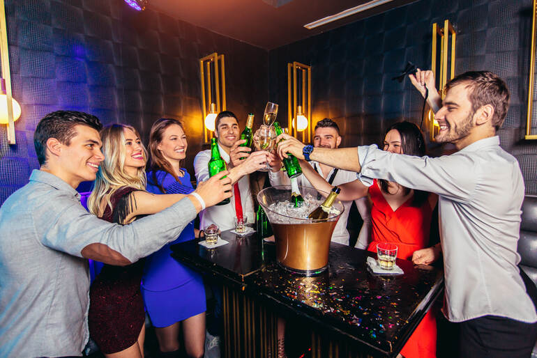 Group enjoying premium bottle service at a Las Vegas nightclub without overpaying.