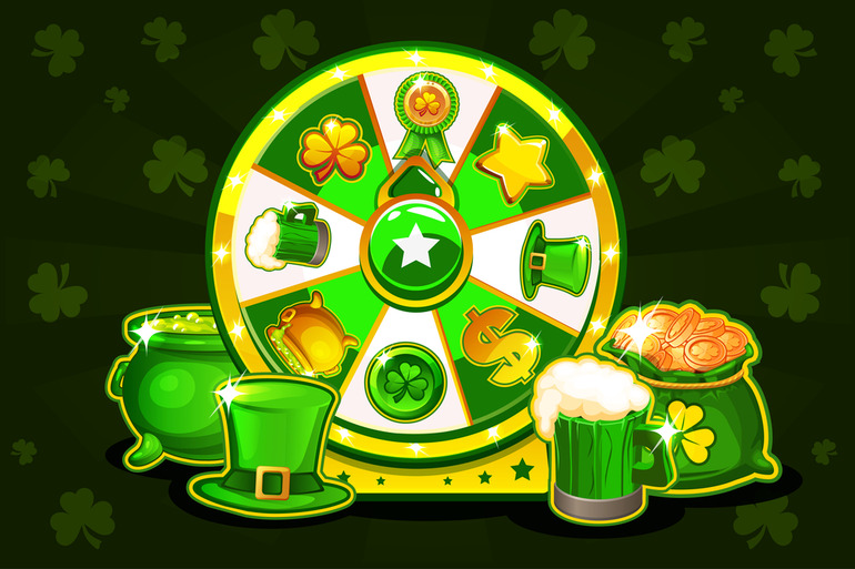 Poker chips, playing cards, a laptop, and a glass of beer on a table.