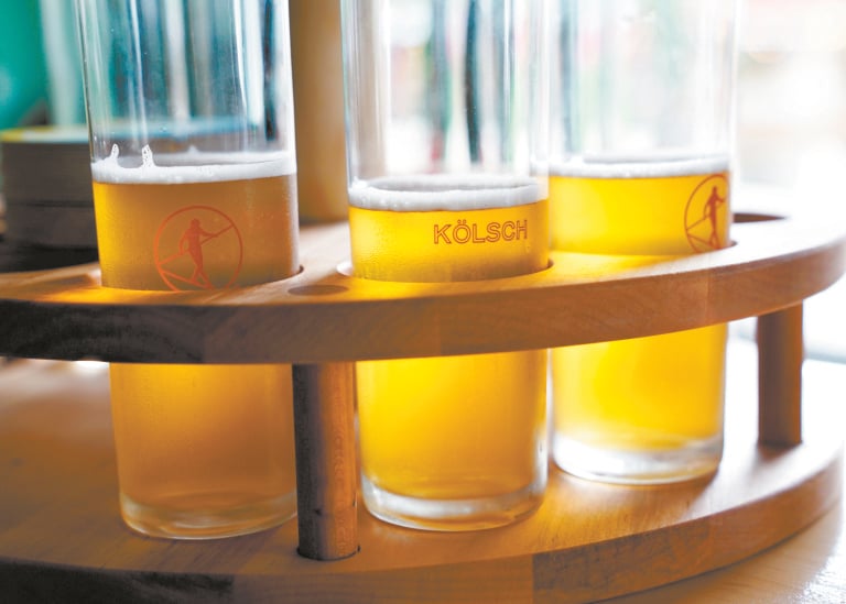 Tray of Kolsch beer glasses.