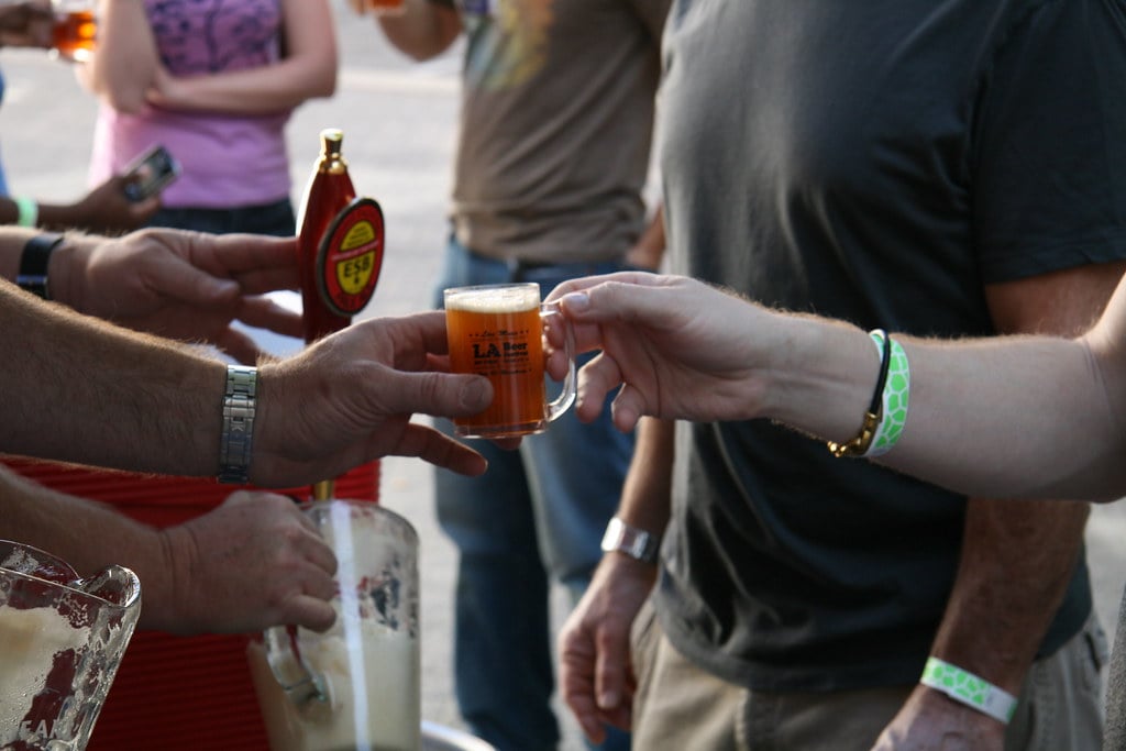 A small sample of beer being handed out at a beer fest