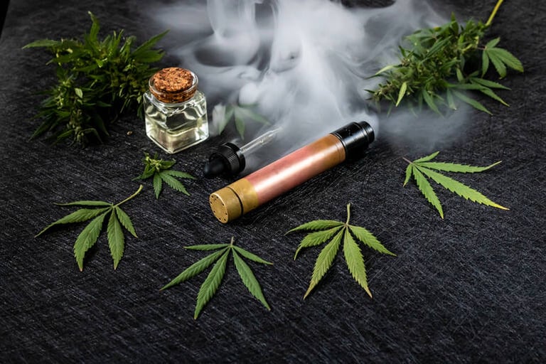 THC vape pen with cannabis leaves and oil, showing vape juice vs flower comparison