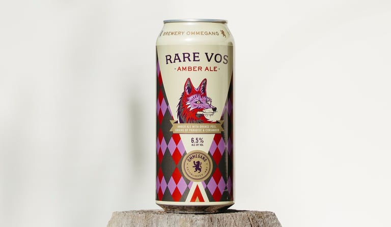 Brewery Ommegang Rare Vos can outside on a pedestal.