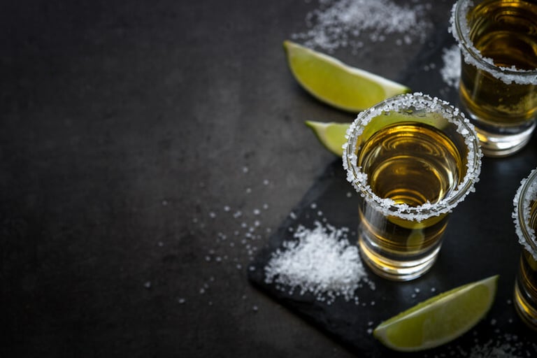 Glass of Tequila on a wooden table