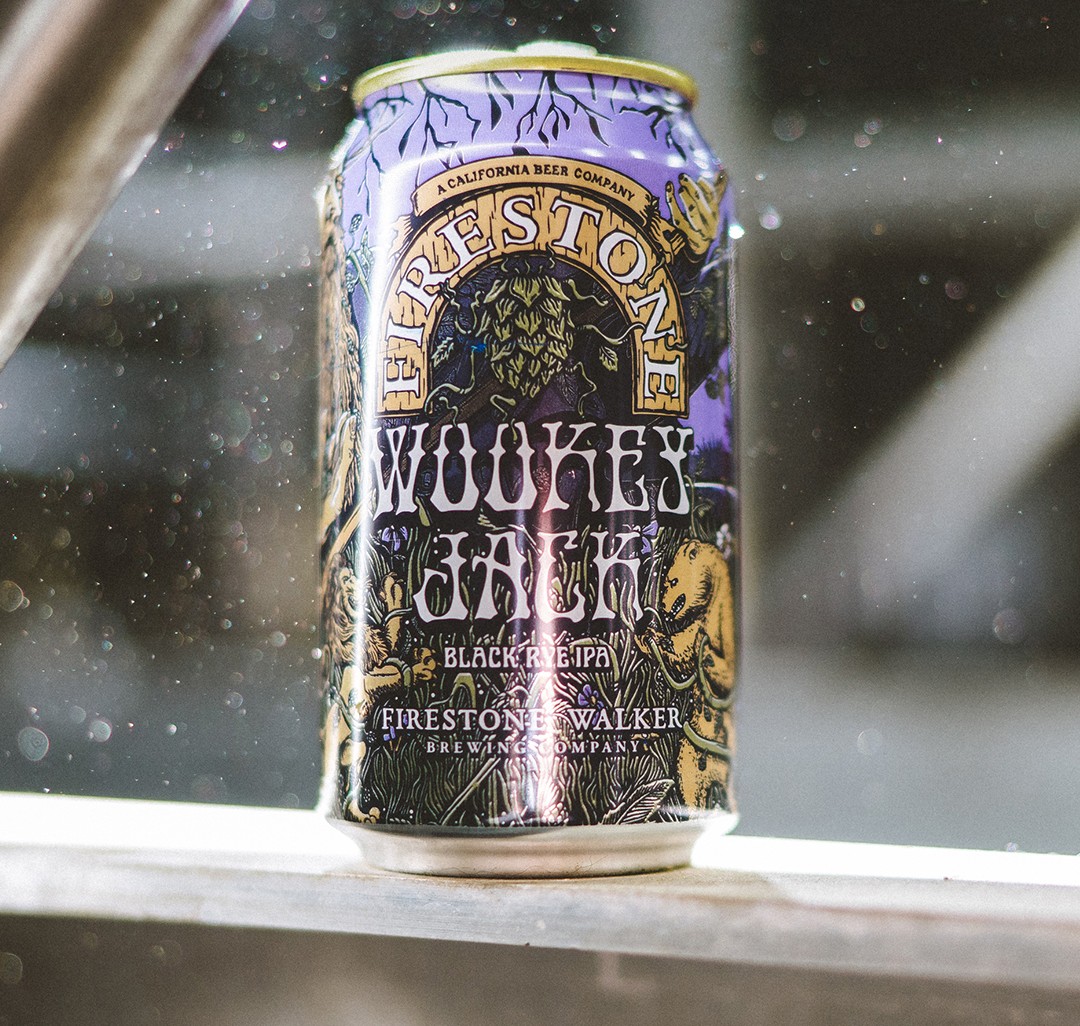 Can of Firestone Walker Wookey Jack Black IPA on wooden shelf.