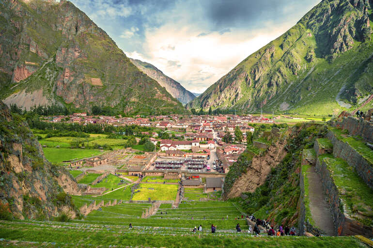 Ollantaytambo Ruins & Village in Peru's Sacred Valley amidst the Andes Mountains.