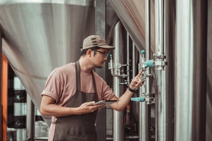 Man checking tank gauge