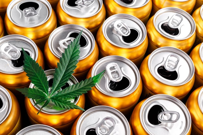 Cannabis leaf above cans of THC beverages.