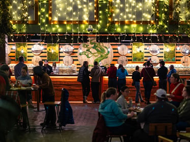 Tree House Brewing Taproom with people ordering beer at the bar.