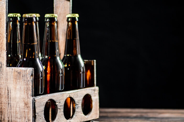 Multiple craft beer bottles arranged together, highlighting freshness and packaging quality in a cold chain distribution setting.