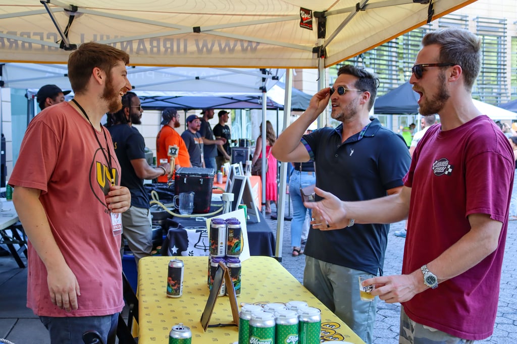 People enjoying themselves at a Summer Ale Festival