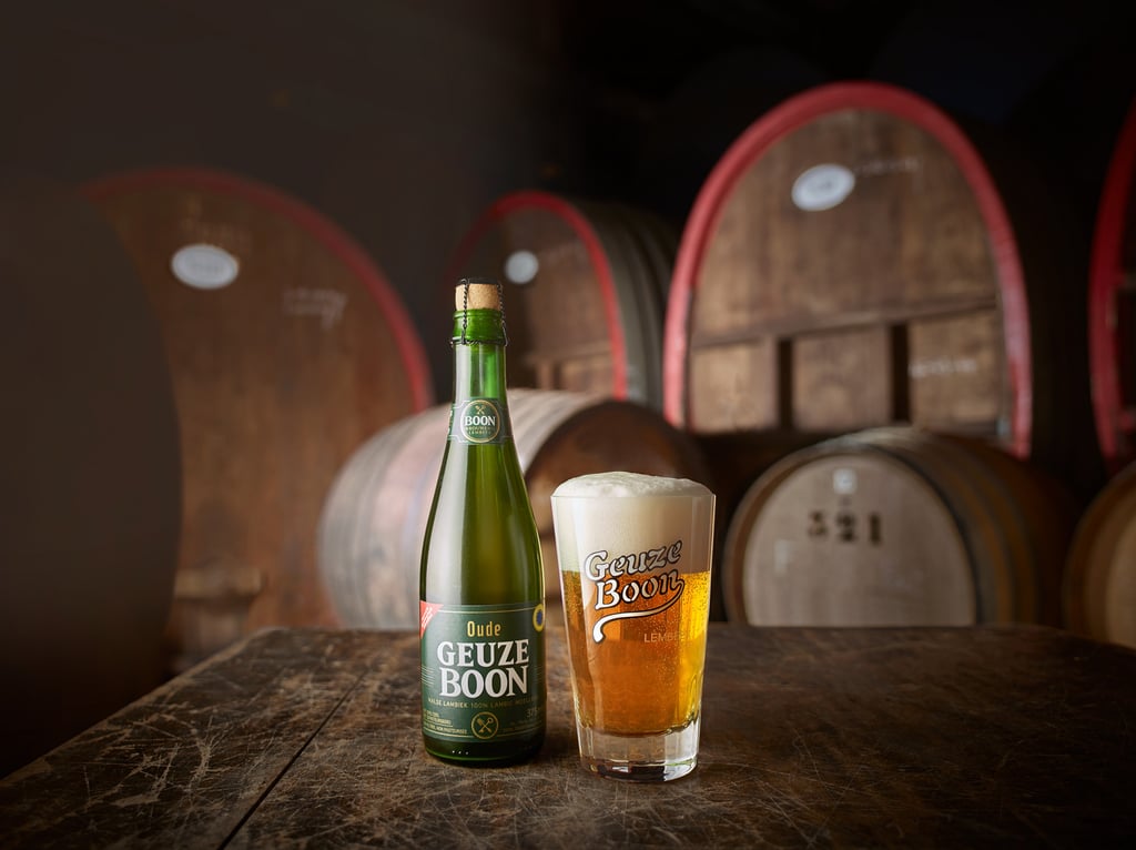 Oude Geuze Boon bottle and glassware in the barrel room of the brewery.