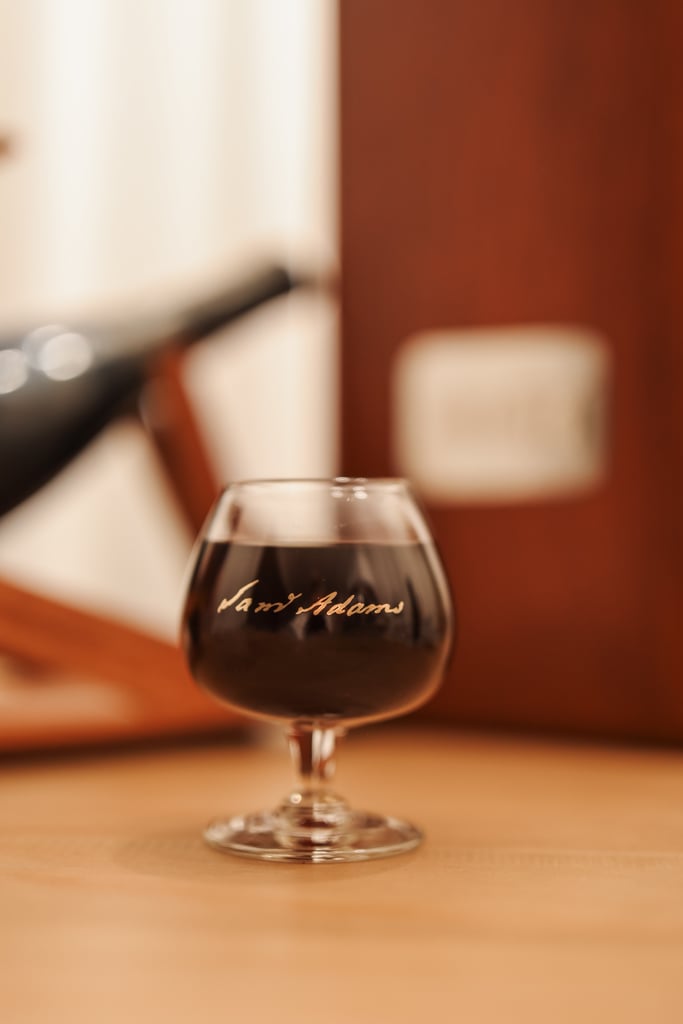 Goblet of Samuel Adams Millennium with special stand behind it.