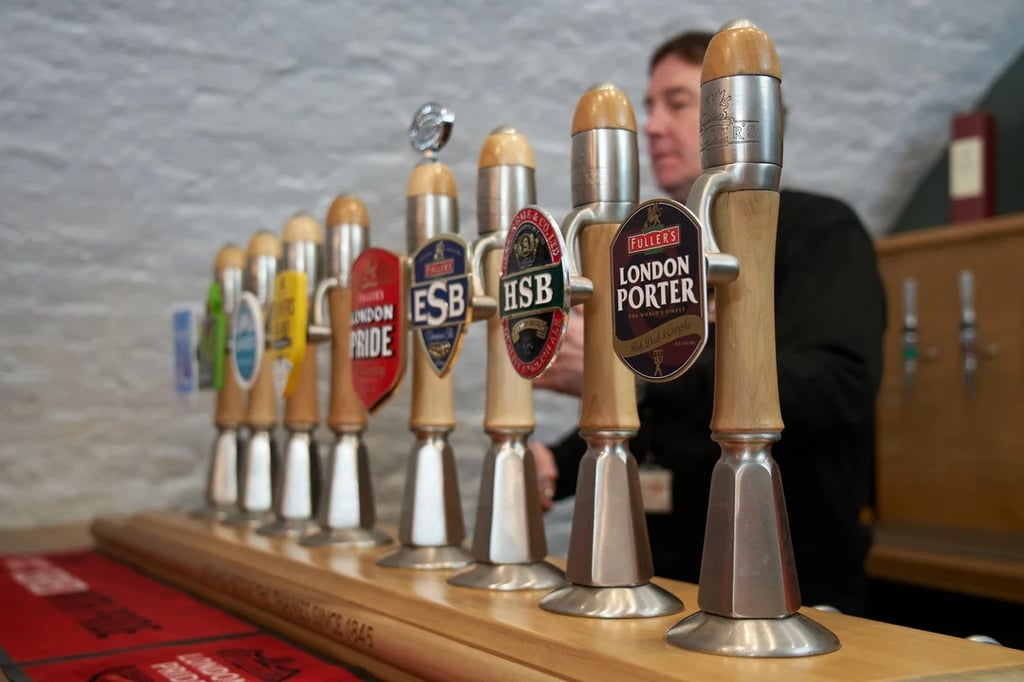Fuller's Brewery tap handles at local pub.
