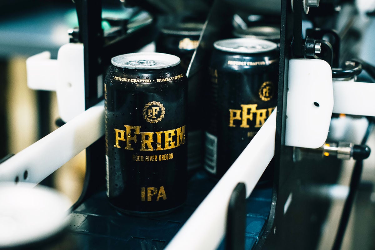 pfriem ipa being canned in canning line