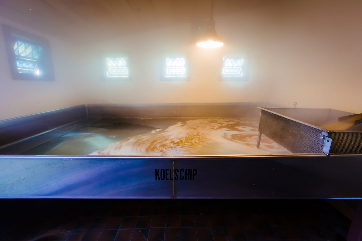 a coolship fermenting beer with wild microflora in the open air