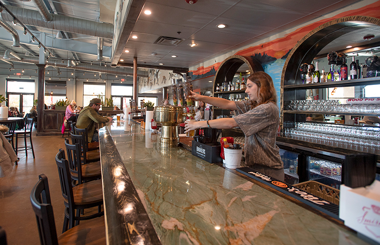 bartender-ally-stogsdill-pours-a-beer-at-flyway-flyway-brewing-in-fayetteville.jpg