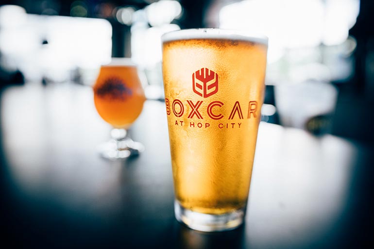 Beer glass on Boxcar Hop City bar