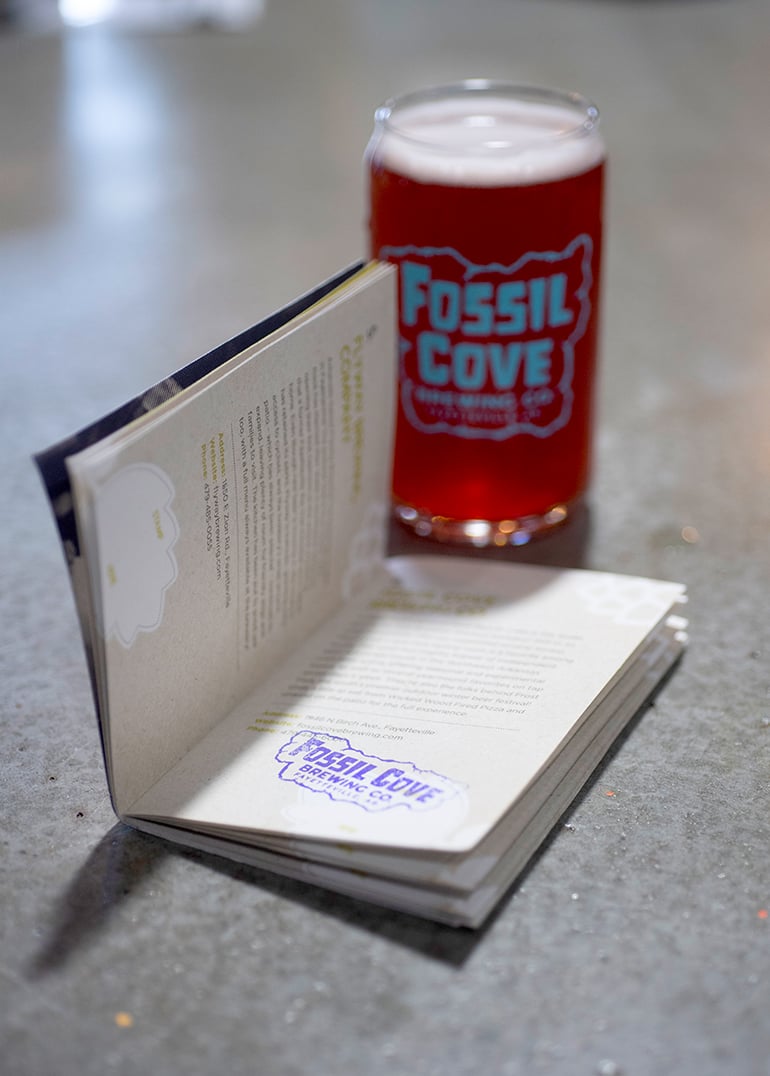 Fossil Cove stamp in an ale trail passport book
